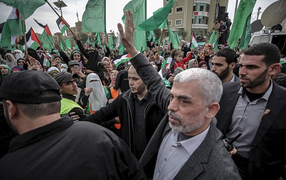Hamas Gaza leader Yahya Al Sinwar waves to supporters 
